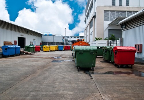 Office clearance scene showing packed boxes and furniture before removal