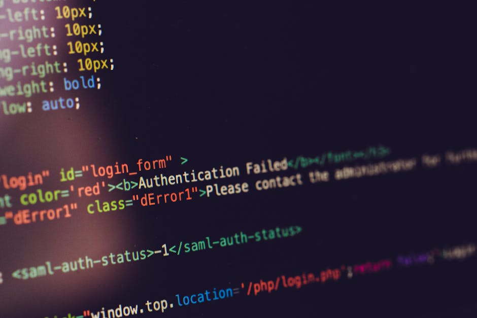 A close-up view of a computer monitor displaying lines of CSS code with various syntax and color-coded elements on a dark background. The code includes font settings such as font weight, family, line 